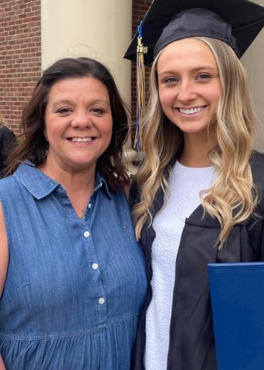 Hadley Duvall with her mother, Jennifer Adkins, during her graduation ceremony