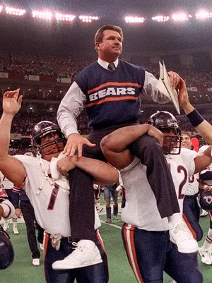 Mike Ditka, carried off the field after leading the team to win over the New England Patriots in 1986. 