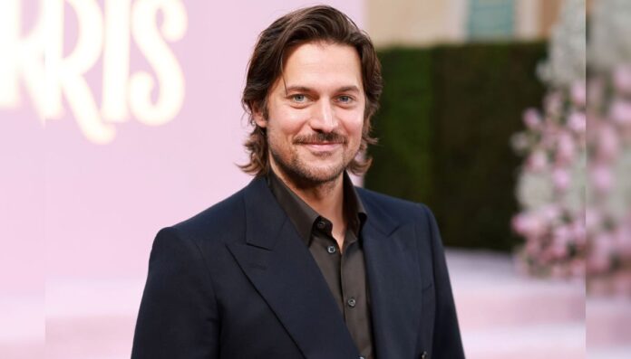 Lucas Bravo at the season four premiere of 'Emily in Paris' Lucas Bravo at the season four premiere of 'Emily in Paris'