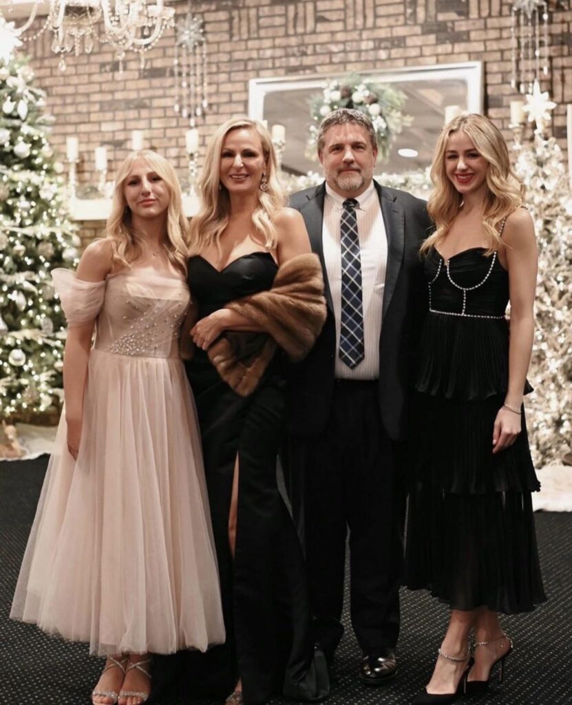 Christi along with her husband, Marc, and their two daughters