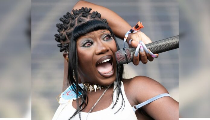 Doechii's powerful stage presence captured in a dynamic moment Doechii's powerful stage presence captured in a dynamic moment