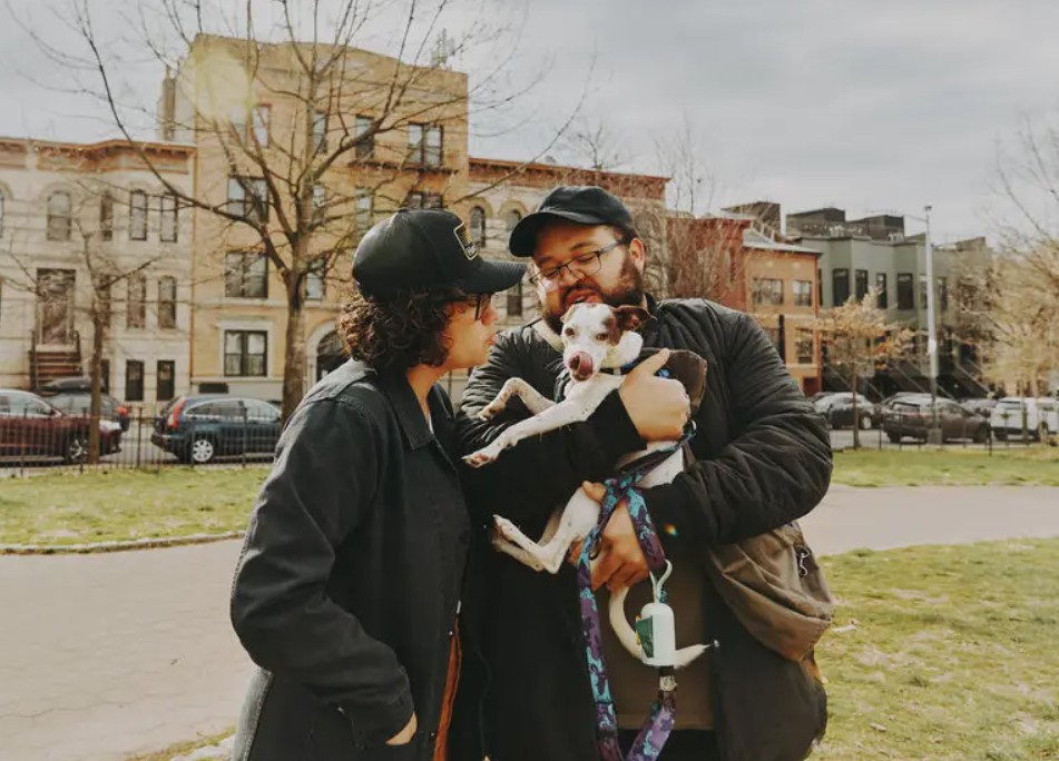 Zach Cherry and his wife, Anabella Cherry, with their rescue dog